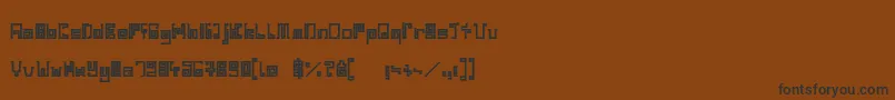 フォントIndiaSnakePixelLabyrinthGameBold – 黒い文字が茶色の背景にあります