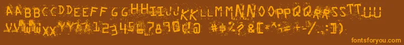 フォントStaubigesVergnР±gen – オレンジ色の文字が茶色の背景にあります。