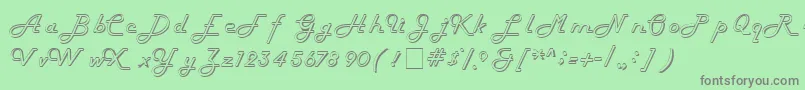 HarlowitcNormal-fontti – harmaat kirjasimet vihreällä taustalla