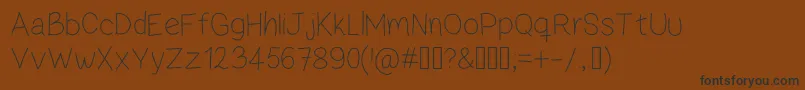 ZamaThin Font – Black Fonts on Brown Background