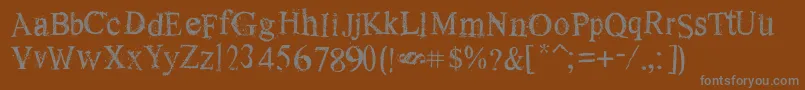 OldDreams-fontti – harmaat kirjasimet ruskealla taustalla