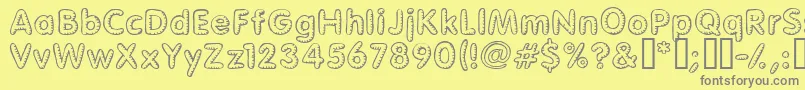 Glimstick Font – Gray Fonts on Yellow Background