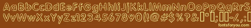 Glimstick Font – Yellow Fonts on Brown Background