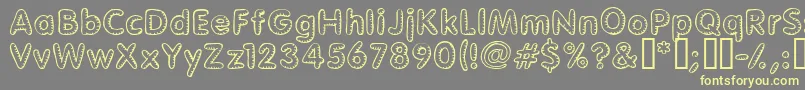 Glimstick Font – Yellow Fonts on Gray Background