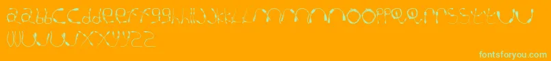 CableGuy-Schriftart – Grüne Schriften auf orangefarbenem Hintergrund