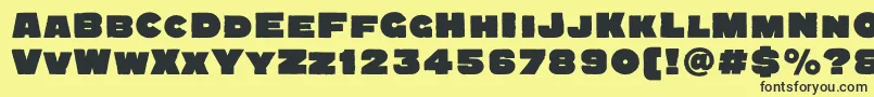 Quadratgroteskblackc Font – Black Fonts on Yellow Background