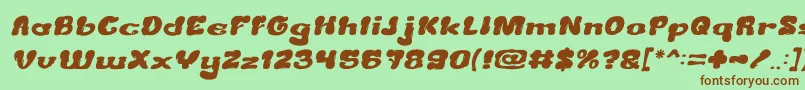 Fonte CreamyButterItalic – fontes marrons em um fundo verde