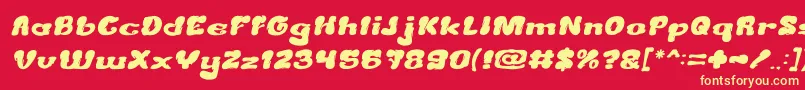 CreamyButterItalic-fontti – keltaiset fontit punaisella taustalla