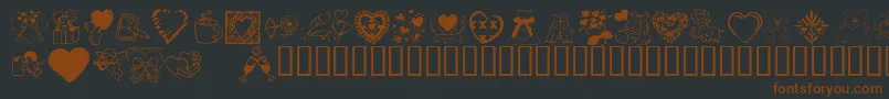 Czcionka KrValentineDings2002 – brązowe czcionki na czarnym tle