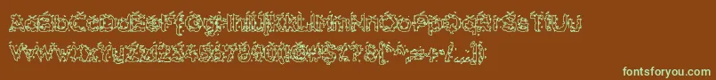 フォントHammh – 緑色の文字が茶色の背景にあります。
