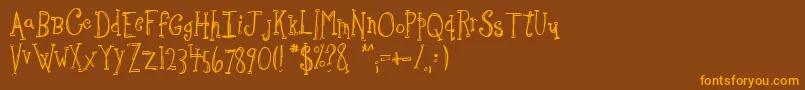 フォントSketchbo – オレンジ色の文字が茶色の背景にあります。