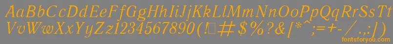 フォントQuantAntiquaItalic.001.001 – オレンジの文字は灰色の背景にあります。