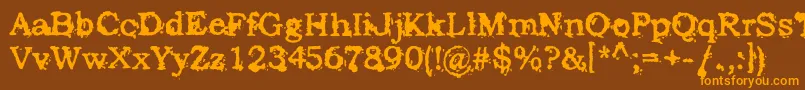 フォントStruckDead – オレンジ色の文字が茶色の背景にあります。