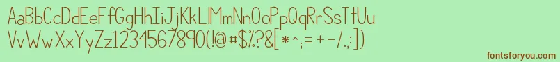 Kgcompassionsimple-Schriftart – Braune Schriften auf grünem Hintergrund
