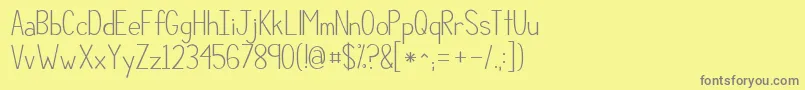 フォントKgcompassionsimple – 黄色の背景に灰色の文字