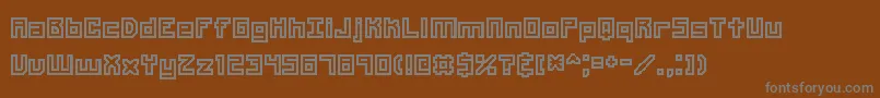 Unlearne-fontti – harmaat kirjasimet ruskealla taustalla