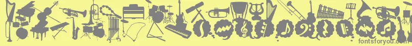 WcMusicaBta-Schriftart – Graue Schriften auf gelbem Hintergrund