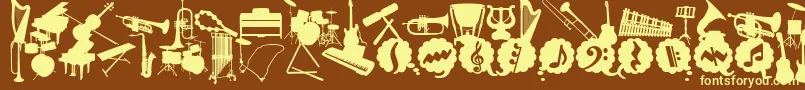 フォントWcMusicaBta – 黄色のフォント、茶色の背景