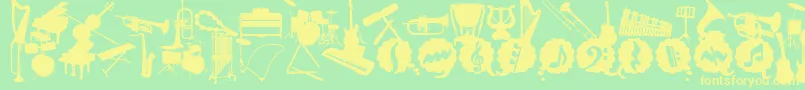 WcMusicaBta-Schriftart – Gelbe Schriften auf grünem Hintergrund