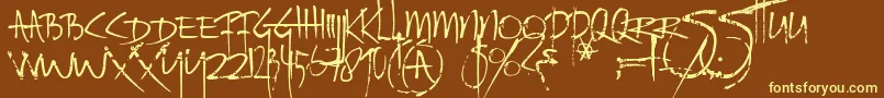 Fonte Ratinfestedmailbox – fontes amarelas em um fundo marrom