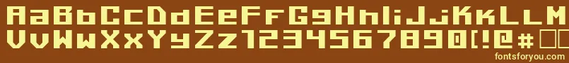 Kiloton1-fontti – keltaiset fontit ruskealla taustalla