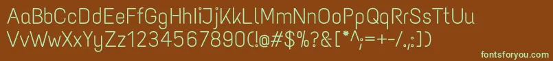 フォントTextmeoneRegular – 緑色の文字が茶色の背景にあります。