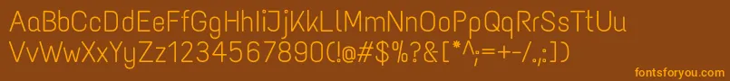 フォントTextmeoneRegular – オレンジ色の文字が茶色の背景にあります。