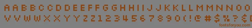 フォントSlkscre – 茶色の文字が灰色の背景にあります。