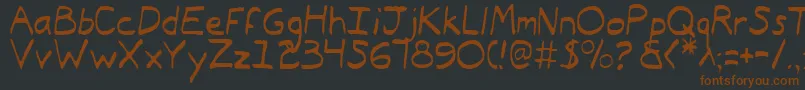 TypeecanoeLight-fontti – ruskeat fontit mustalla taustalla