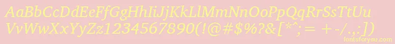 CharisSilItalic-fontti – keltaiset fontit vaaleanpunaisella taustalla