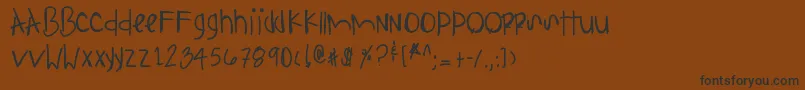 フォントAnythingispossible – 黒い文字が茶色の背景にあります