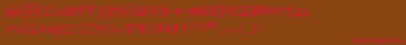 フォントAnythingispossible – 赤い文字が茶色の背景にあります。