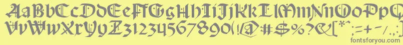 フォントSchampel – 黄色の背景に灰色の文字