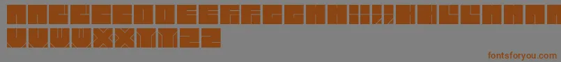 Bloktypefaceフォントについての詳細 フォントBloktypeface – 茶色の文字が灰色の背景にあります。