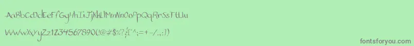 StandardNibHandwritten-fontti – harmaat kirjasimet vihreällä taustalla