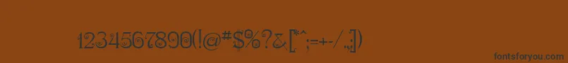 フォントNymphaOne – 黒い文字が茶色の背景にあります