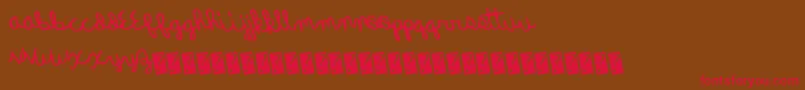 Quickrodeo-Schriftart – Rote Schriften auf braunem Hintergrund