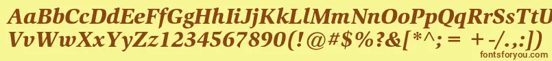 フォントSlimbachstdBlackitalic – 茶色の文字が黄色の背景にあります。