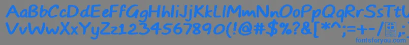 Czcionka TypoComicsBoldDemo – niebieskie czcionki na szarym tle