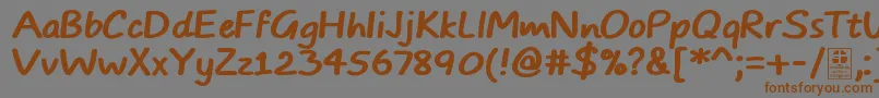 Czcionka TypoComicsBoldDemo – brązowe czcionki na szarym tle