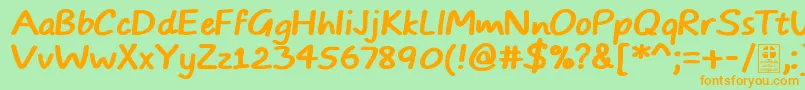 TypoComicsBoldDemo-fontti – oranssit fontit vihreällä taustalla