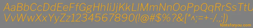 フォントLibrefranklinExtralightitalic – オレンジの文字は灰色の背景にあります。