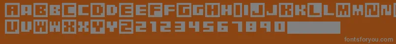 Czcionka PixelGrafiti – szare czcionki na brązowym tle