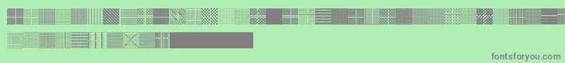 Serangkaianpattern-fontti – harmaat kirjasimet vihreällä taustalla