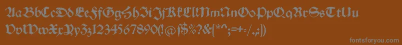 Schwabachduemille-Schriftart – Graue Schriften auf braunem Hintergrund