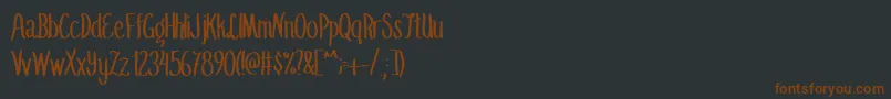 Шрифт SummerflingMedium – коричневые шрифты на чёрном фоне