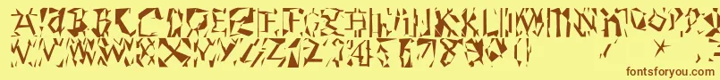 フォントModernrunes – 茶色の文字が黄色の背景にあります。