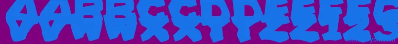 PrehistoricCaveman Font – Blue Fonts on Purple Background