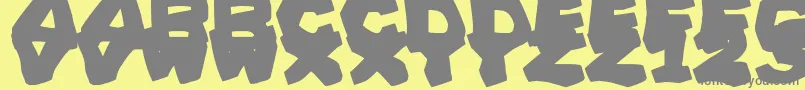 Шрифт PrehistoricCaveman – серые шрифты на жёлтом фоне