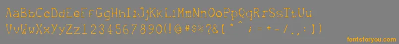 Metrique Font – Orange Fonts on Gray Background